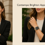 Woman wearing an Apple Watch with Brighton’s Contempo silver and gold link band, styled in a black blazer.