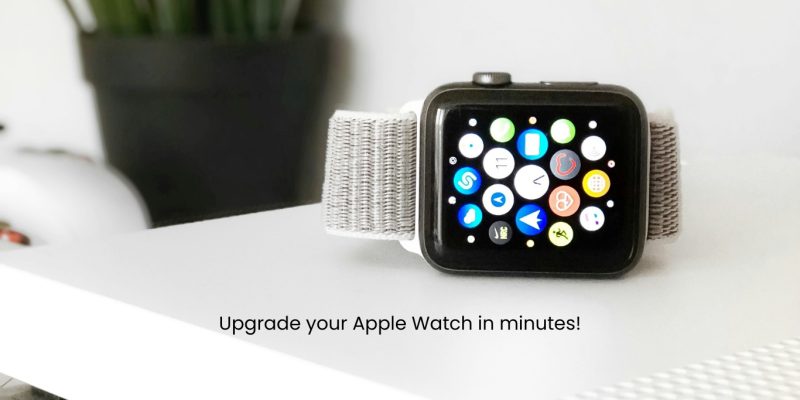 Apple watch placed on white table with a flower pot in background