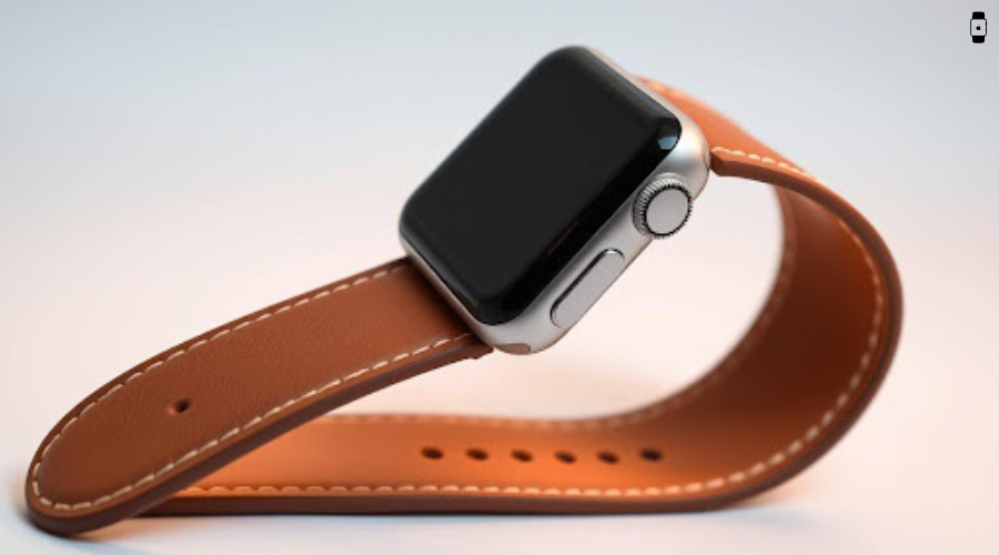 Close-up of an Apple Watch with a smooth, tan faux leather band gracefully arched, showcasing its elegant stitching, premium finish, and modern design against a soft gradient background.